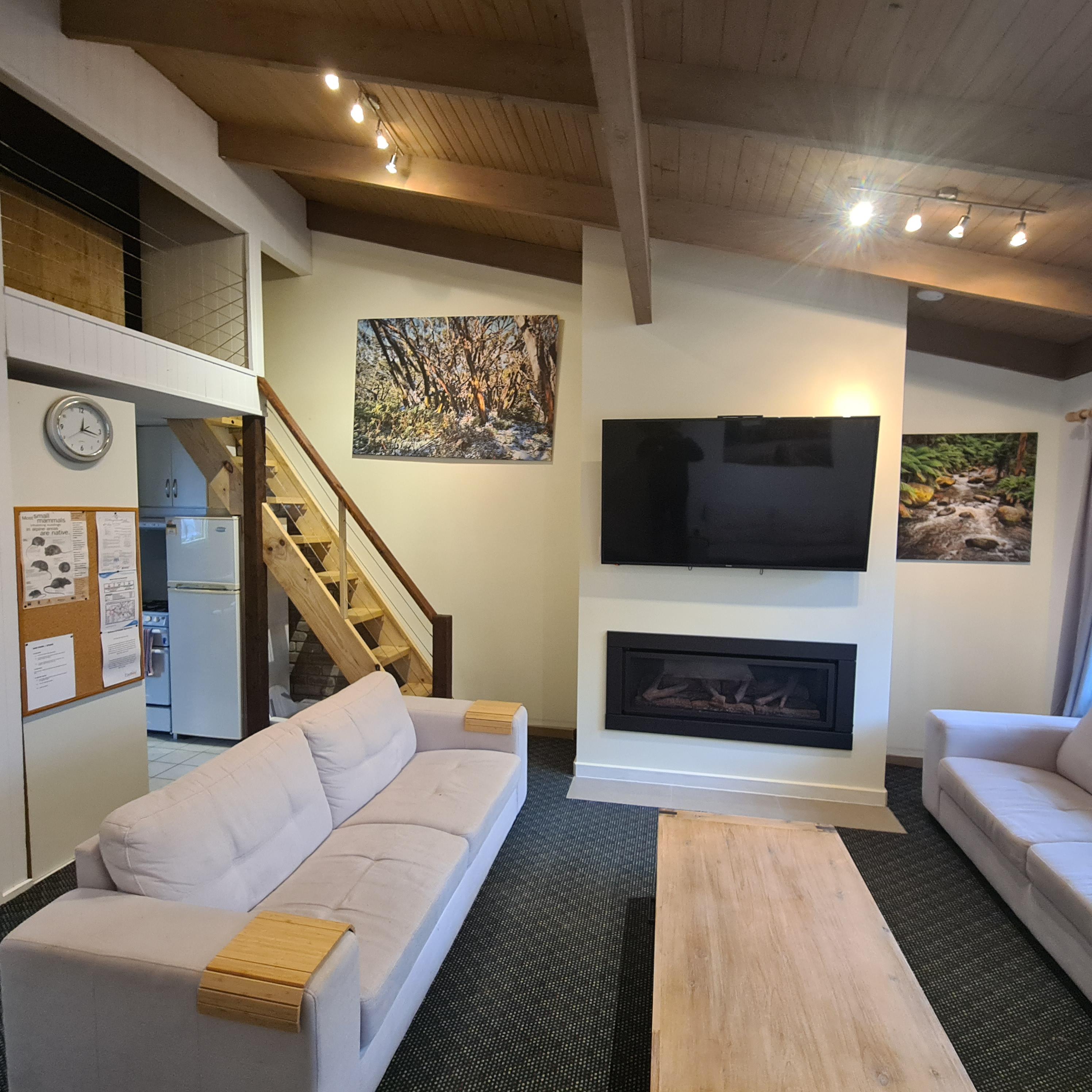 Living room with gas fireplace and flat screen TV
